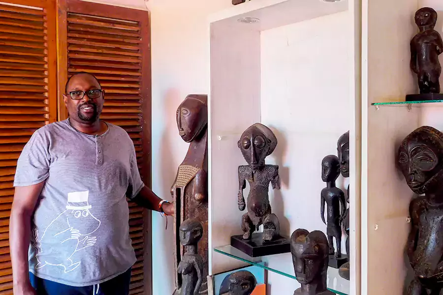 joe ndyanabangi with cultural art pieces